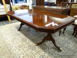 MAHOGANY DOUBLE PEDESTAL DINING TABLE WITH BRASS CAPPED FEET AND TWO 15.5 IN LEAVES. WITH BOTH