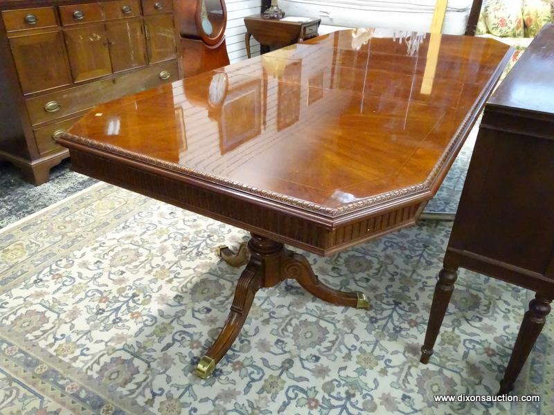 MAHOGANY DOUBLE PEDESTAL DINING TABLE WITH BRASS CAPPED FEET AND TWO 15.5 IN LEAVES. WITH BOTH