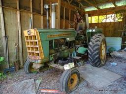 (LARGE SHED) OLIVER 1800 GAS POWERED TRACTOR. MODEL 38-1102. BOTH FRONT TIRES ARE FLAT. ITEM IS SOLD