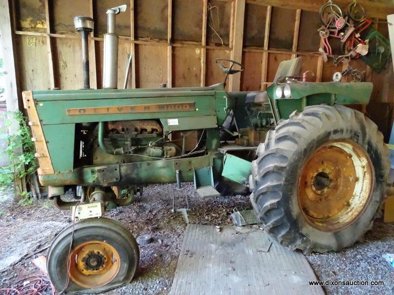 (LARGE SHED) OLIVER 1800 GAS POWERED TRACTOR. MODEL 38-1102. BOTH FRONT TIRES ARE FLAT. ITEM IS SOLD