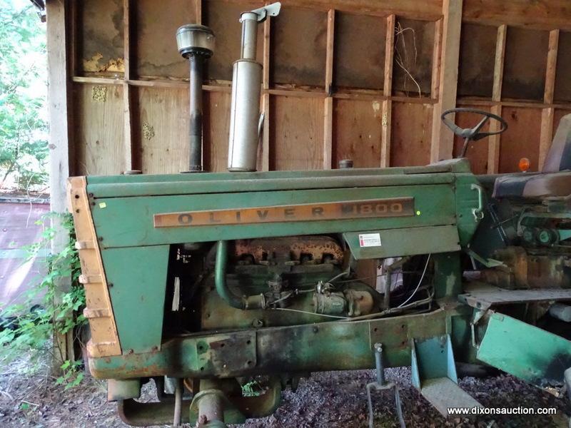 (LARGE SHED) OLIVER 1800 GAS POWERED TRACTOR. MODEL 38-1102. BOTH FRONT TIRES ARE FLAT. ITEM IS SOLD