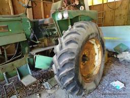 (LARGE SHED) OLIVER 1800 GAS POWERED TRACTOR. MODEL 38-1102. BOTH FRONT TIRES ARE FLAT. ITEM IS SOLD