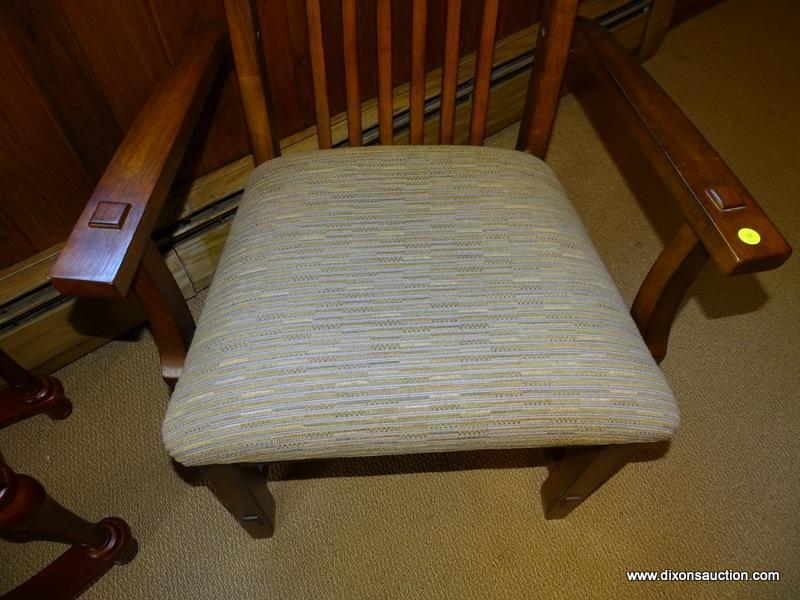 (DWN LR) SOLID OAK ARM CHAIR WITH BROWN AND TAN UPHOLSTERED SEAT WITH SLAT BACK. IS 1 OF A PAIR.