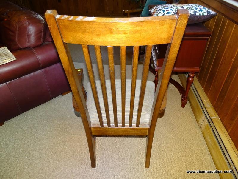 (DWN LR) SOLID OAK ARM CHAIR WITH BROWN AND TAN UPHOLSTERED SEAT WITH SLAT BACK. IS 1 OF A PAIR.