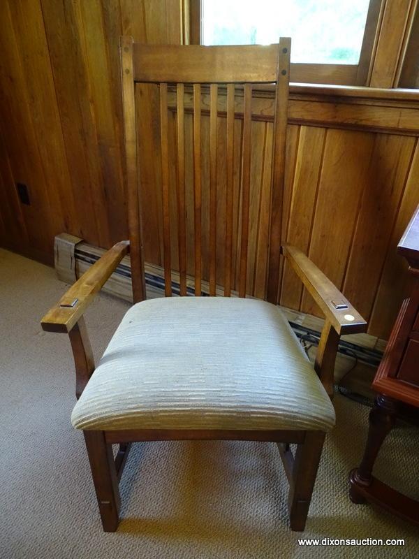 (DWN LR) SOLID OAK ARM CHAIR WITH BROWN AND TAN UPHOLSTERED SEAT WITH SLAT BACK. IS 1 OF A PAIR.