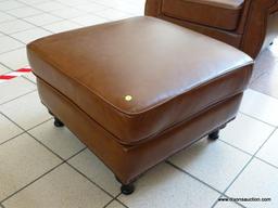 BRAND NEW ABBYSON TOP GRAIN LEATHER OTTOMAN WITH BRASS STUDDED ACCENTS AROUND THE EDGES. MEASURES 29