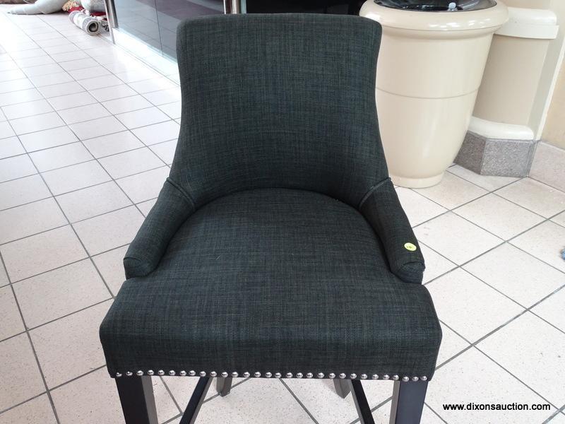 BRAND NEW GRAY UPHOLSTERED BAR CHAIR WITH SILVER TONE STUDDING AROUND THE EDGES. MEASURES 20 IN X 21