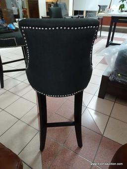 BRAND NEW GRAY UPHOLSTERED BAR CHAIR WITH SILVER TONE STUDDING AROUND THE EDGES. MEASURES 20 IN X 21