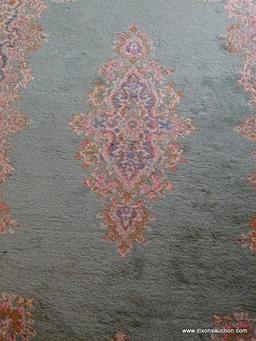 (FOYER) HANDMADE KIRMAN ORIENTAL RUG IN GREEN AND IVORY- 6' X 9', ITEM IS SOLD AS IS WHERE IS