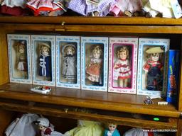 (UPBED 1) SHELF LOT 0F 6 SHIRLEY TEMPLE DOLLS IN ORIGINAL BOXES AND INCLUDES ANNIE DOLL IN BOX- 6 IN