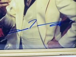 JOHN TRAVOLTA SIGNED PHOTOGRAPH WITH COA. IS IN A GOLD TONE FRAME. MEASURES 9 IN X 11 IN. ITEM IS