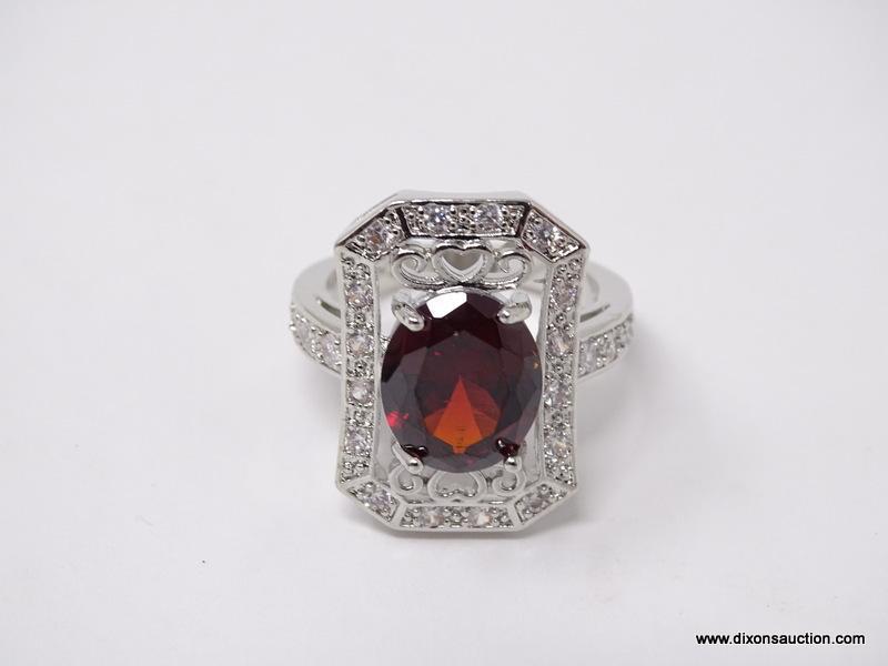 .925 STERLING SILVER LADIES 4 CT GARNET COCKTAIL RING. SIZE 8.