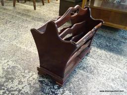 (R1) MAHOGANY MAGAZINE HOLDER WITH CENTER HANDLE. MEASURES 12 IN X 18 IN X 17 IN. ITEM IS SOLD AS