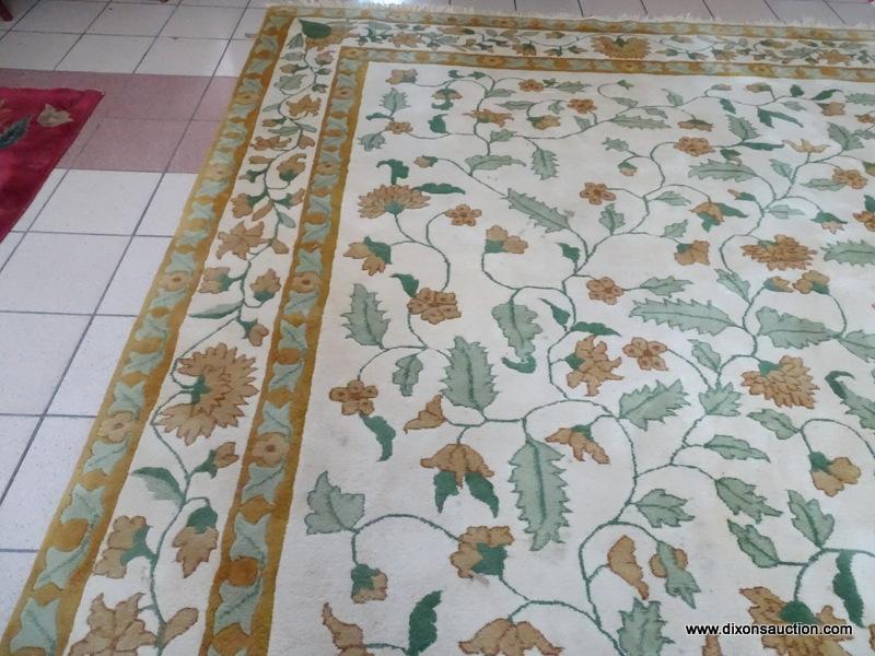 CHINESE SCULPTED AREA RUG IN IVORY, GREEN, AND FLORAL. MEASURES APPROXIMATELY 10 FT X 14 FT. ITEM IS