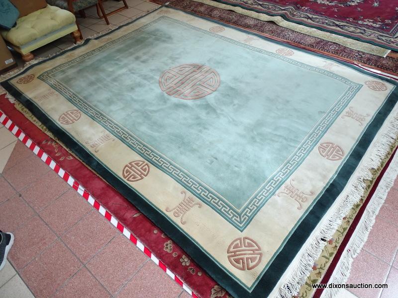 HANDMADE SCULPTED CHINESE RUG IN GREEN, IVORY AND BEIGE WITH CHINESE SCRIPT. MEASURES APPROXIMATELY