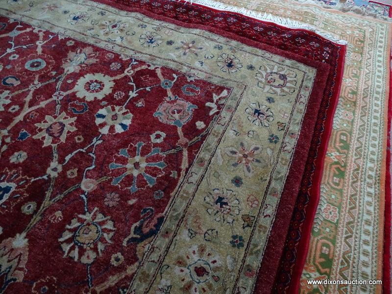 MACHINE MADE ORIENTAL STYLE AREA RUG IN MAROON, IVORY, AND GREEN. MEASURES APPROXIMATELY 7 FT 10 IN