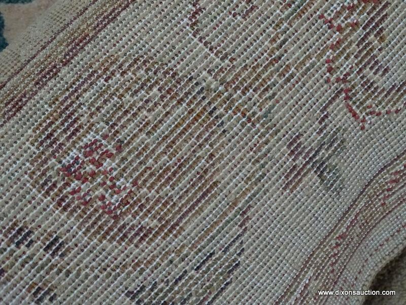 MACHINE MADE ORIENTAL STYLE AREA RUG IN BEIGE AND RUST. IN THE SPHINX PATTERN. MEASURES