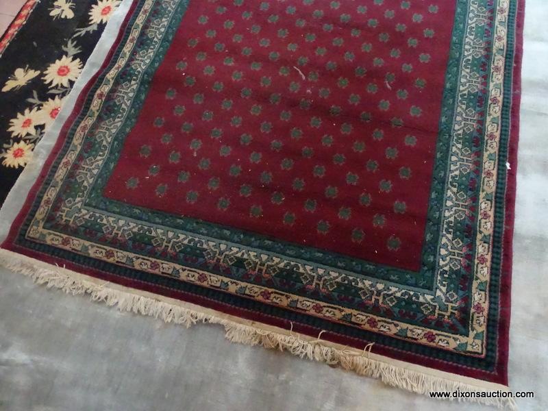 MACHINE MADE ORIENTAL STYLE IN BURGUNDY, GREEN, AND BEIGE. MEASURES APPROXIMATELY 5 FT 4 IN X 7 FT 8