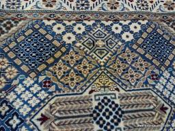 HANDMADE IRANIAN AREA RUG IN IVORY, BLUE, AND BROWN. MEASURES APPROXIMATELY 2 FT 11 IN X 4 FT 6 IN.