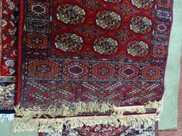 HANDMADE MACHINE TURKISH RUG IN MAROON, IVORY, AND BLUE. MEASURES APPROXIMATELY 3 FT X 6 FT. ITEM IS