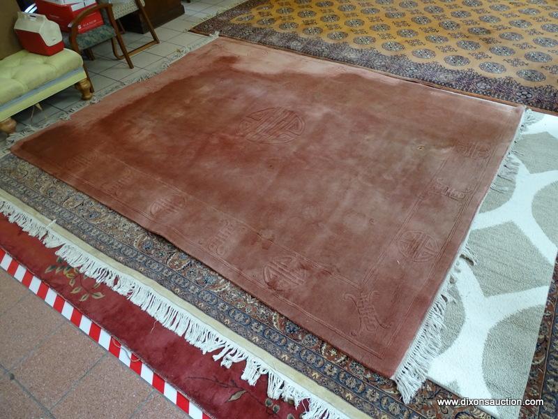 ESTATE OWNED MACHINE MADE MAUVE ORIENTAL SCULPTED RUG. MEASURES APPROXIMATELY 7 FT 11 IN X 10 FT 6