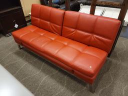 (R1) RED BONDED LEATHER MODERN CONVERTIBLE SOFA BED W/CHROME LEGS. HAS USB PLUG-INS ON THE SIDES AS