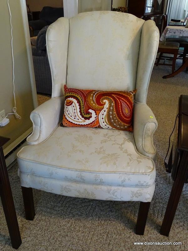 (FR) CREAM COLORED UPHOLSTERED WINGBACK CHAIR WITH BLOCK LEGS. MEASURES APPROX. 29" X 27" X 33".