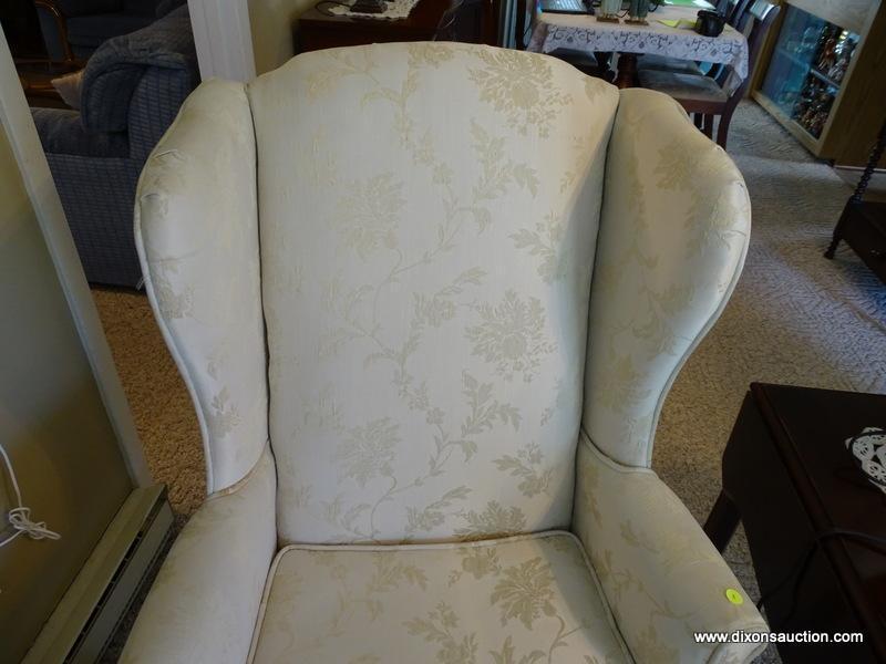 (FR) CREAM COLORED UPHOLSTERED WINGBACK CHAIR WITH BLOCK LEGS. MEASURES APPROX. 29" X 27" X 33".