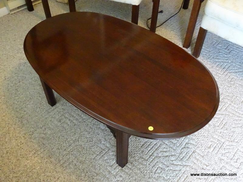(FR) OVAL COFFEE TABLE WITH REEDED LEGS. MEASURES 43-1/2" X 27-1/2" X 16"T.