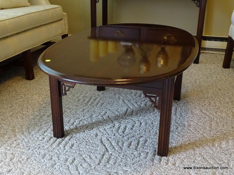 (FR) OVAL COFFEE TABLE WITH REEDED LEGS. MEASURES 43-1/2" X 27-1/2" X 16"T.