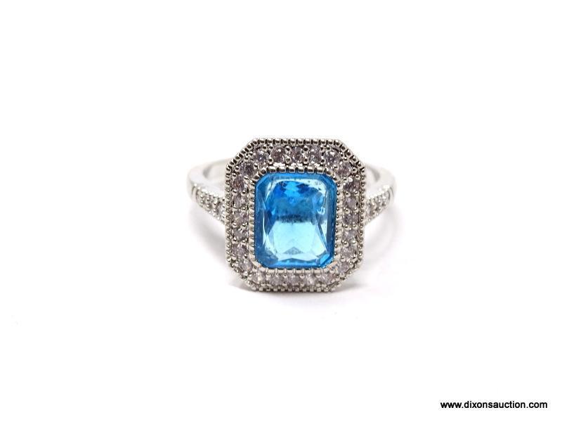 .925 STERLING SILVER LADIES 2-1/2 CT BLUE TOPAZ RING. SIZE 8. ITEM IS SOLD AS IS WHERE IS WITH NO