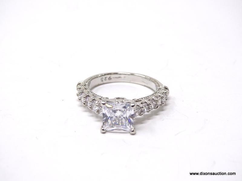 .925 STERLING SILVER LADIES 2 CT ENGAGEMENT RING. SIZE 7. ITEM IS SOLD AS IS WHERE IS WITH NO