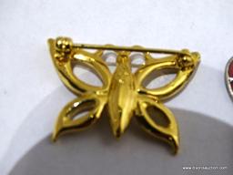(SC) PAIR OF BUTTERFLY THEMED BROOCHES. 1 IS SILVER TONED AND 1 IS GOLD TONED. ITEM IS SOLD AS IS,