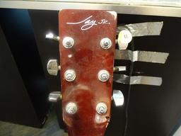 (SC) JAY JR. ACOUSTIC ELECTRIC GUITAR. NEEDS STRINGS, PEGS, AND LOWER TENSION BAR. MODEL