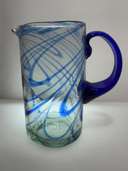 (2B) FOUR BLUE GLASS PITCHERS INCLUDING HAND BLOWN 9.5 INCH PITCHER (POSSIBLY NOVICA FIESTA);