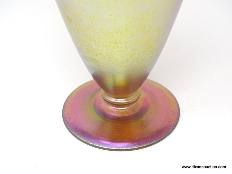 Gold iridescent vase having a wide lip and shoulder tapering to a thin ankle above a round foot. 8