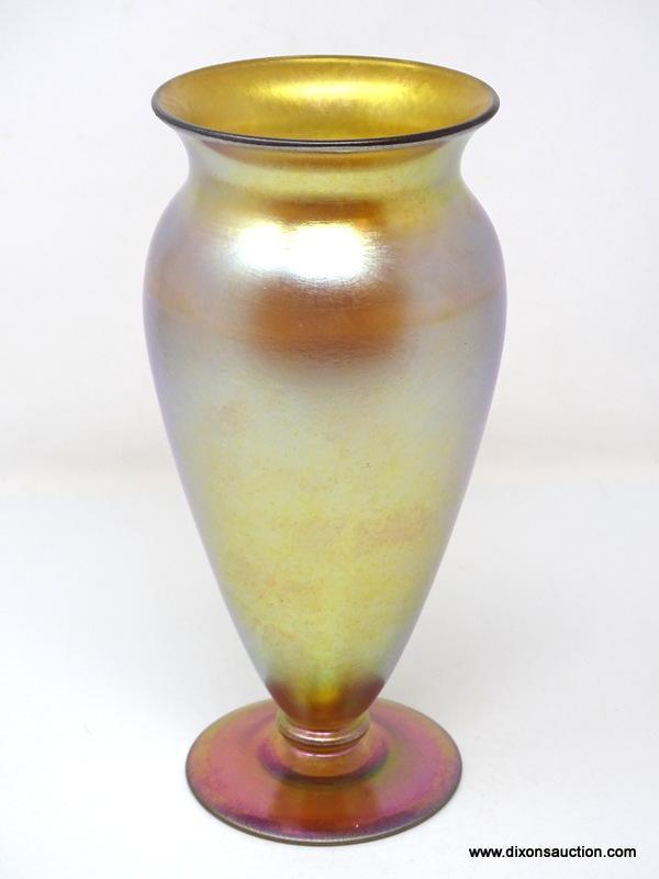 Gold iridescent vase having a wide lip and shoulder tapering to a thin ankle above a round foot. 8