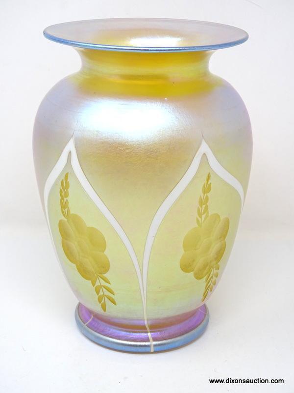 A gold iridescent vase having a wide flaring rim over wide shoulders tapering to form a rolled foot