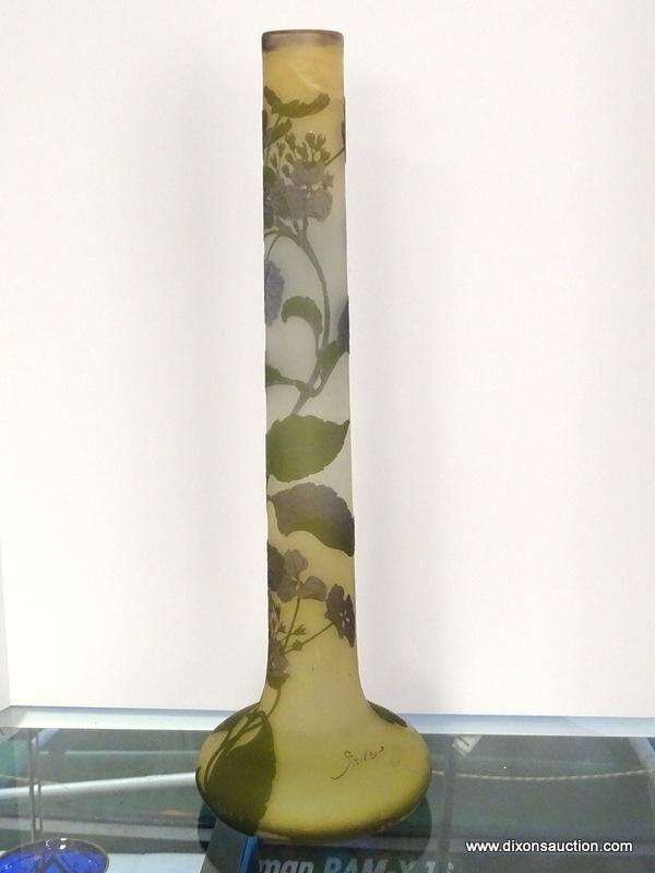 An acid cut, tri-colored French Cameo glass stick vase. The acid cut vase has 3 layers of colored