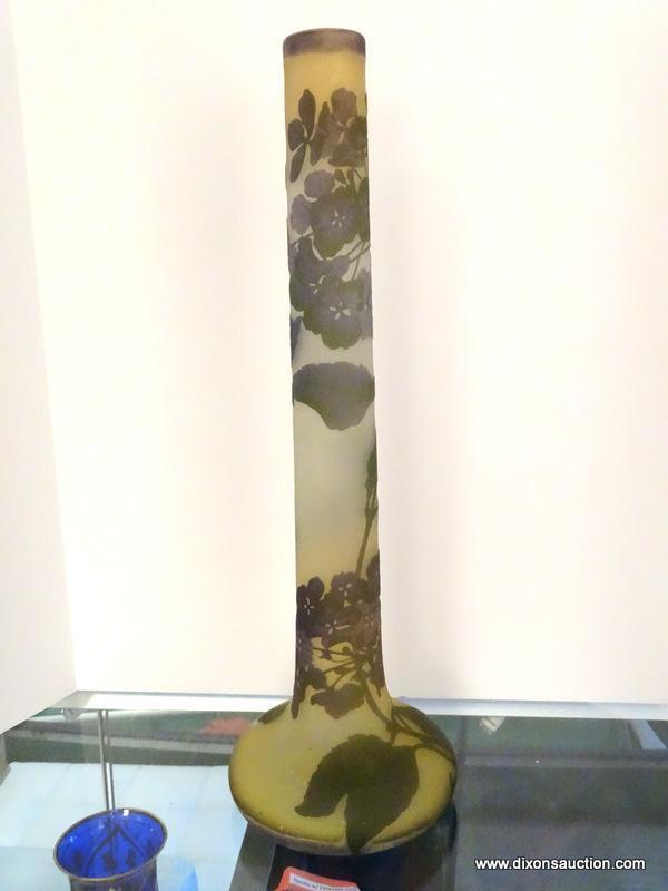 An acid cut, tri-colored French Cameo glass stick vase. The acid cut vase has 3 layers of colored