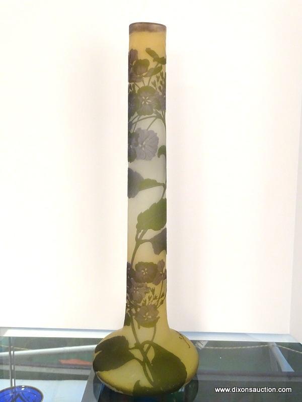 An acid cut, tri-colored French Cameo glass stick vase. The acid cut vase has 3 layers of colored