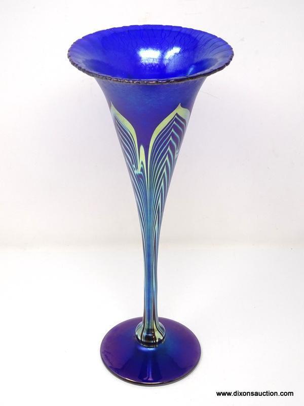 Cobalt Blue, iridescent finished trumpet vase having with a stretched finish. The tapering body and