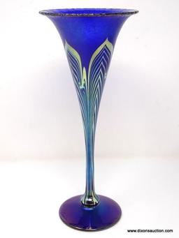 Cobalt Blue, iridescent finished trumpet vase having with a stretched finish. The tapering body and