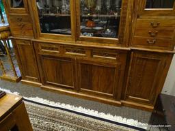 (R1) ANTIQUE 2 PIECE BRAZILIAN WOOD CHINA CABINET WITH WOODEN SHELVES AND BRASS PULLS. HAS KEY.