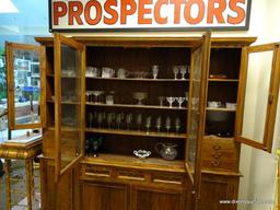 (R1) ANTIQUE 2 PIECE BRAZILIAN WOOD CHINA CABINET WITH WOODEN SHELVES AND BRASS PULLS. HAS KEY.