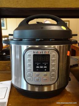 CENTER ROW FRONT - INSTANT POT - NO CORD FOUND. ITEM IS SOLD AS IS WHERE IS WITH NO GUARANTEE OR