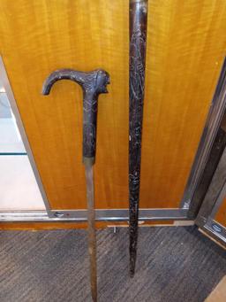 ANTIQUE WOOD CARVED INDIAN HEAD SWORD WALKING CANE, APPROXIMATELY 38 IN.