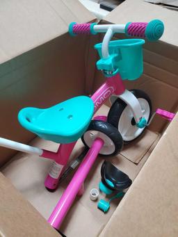 Gomo pink push along tricycle for girls. Item appears to have missing or broken pieces, see pictures