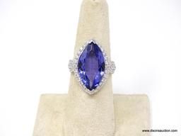 PLATINUM LADIES CAST TANZANITE AND DIAMOND RING.