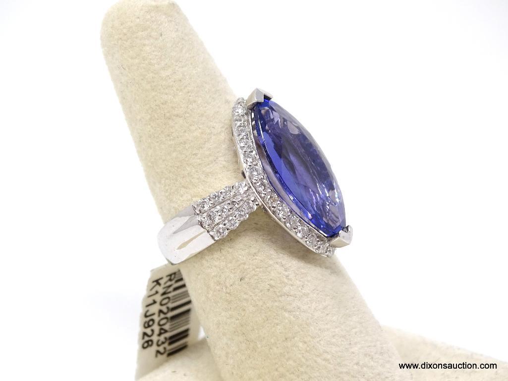 PLATINUM LADIES CAST TANZANITE AND DIAMOND RING.